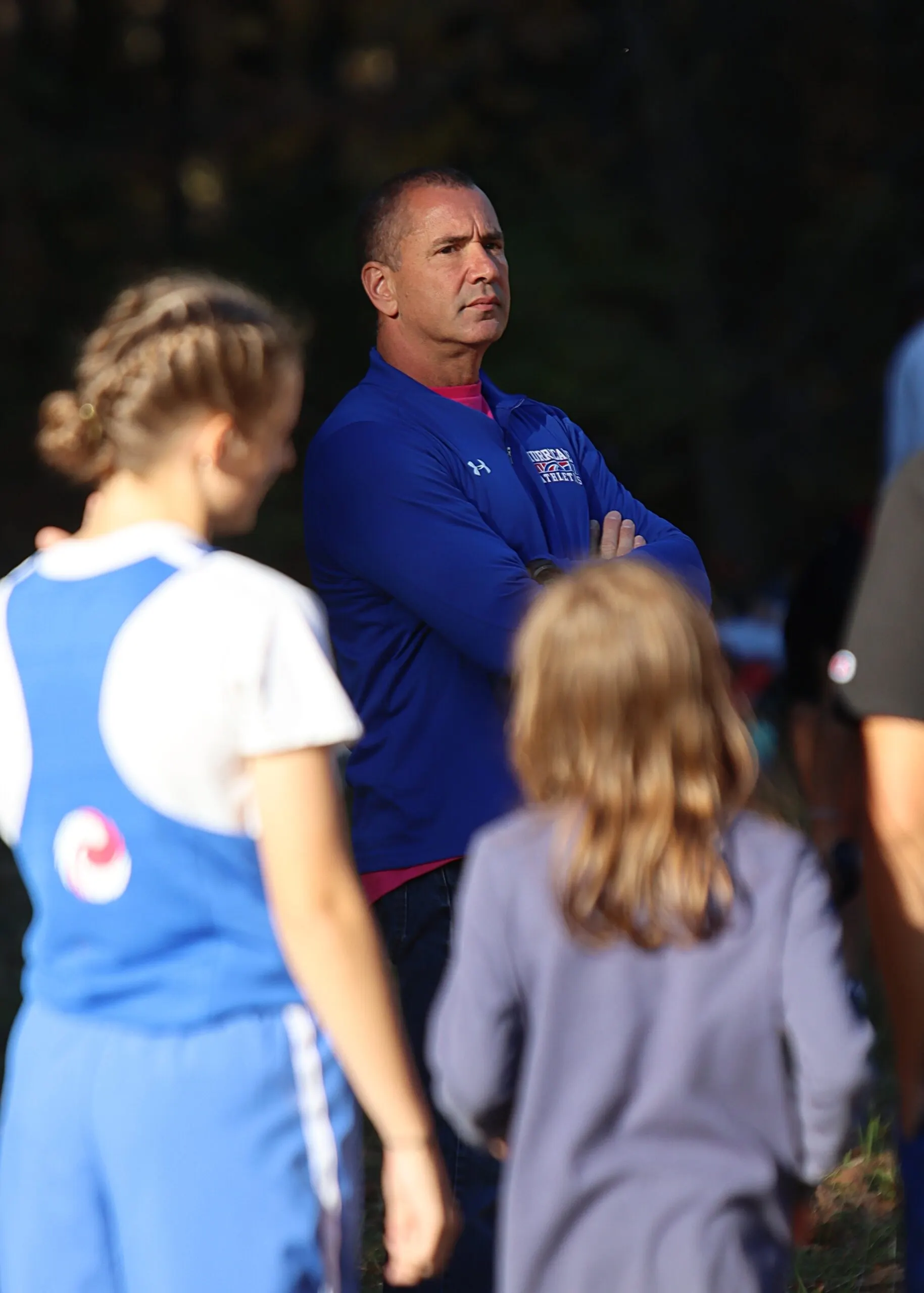 Coach Joe talking one-on-one with a player